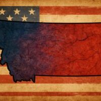 A weathered map of Montana bleeds red and blue over a faded American flag, symbolizing the state’s turbulent political identity—part frontier independence, part populist rebellion.
