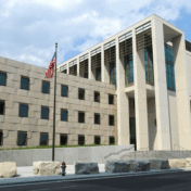 Modern Courthouse Exterior with American Flag Modern Courthouse Exterior with American Flag