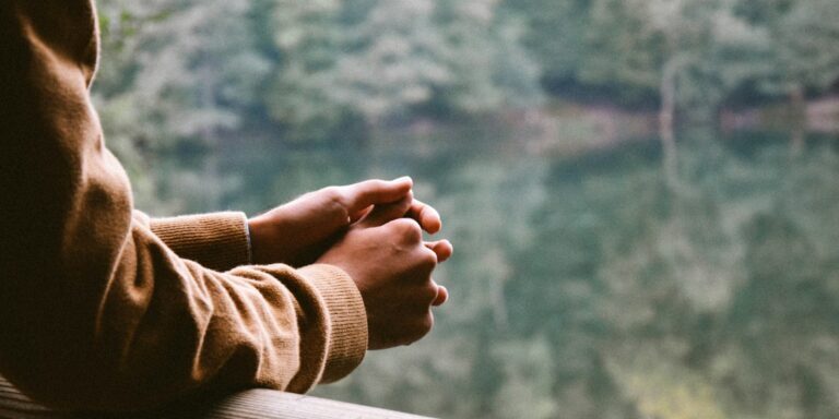 tilt-shift photography of person in brown jacket