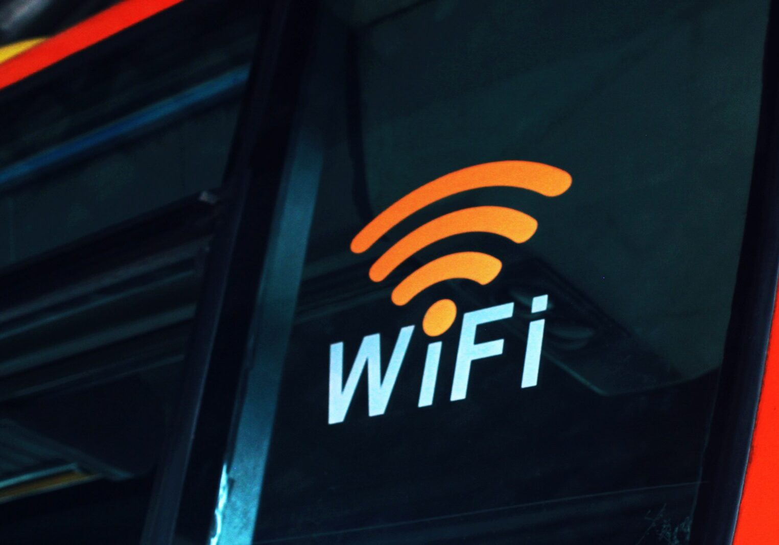 Photo by Dreamlike Street a close up of the wifi logo on the side of a bus
