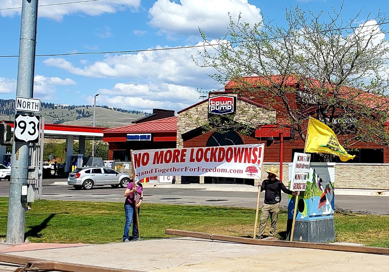 Stand Together For Freedom banner at North East corner of North Reserve and Mullan.