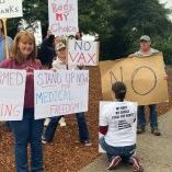 Healthcare workers and community members protest vaccine mandates. Healthcare workers and community members protest vaccine mandates.