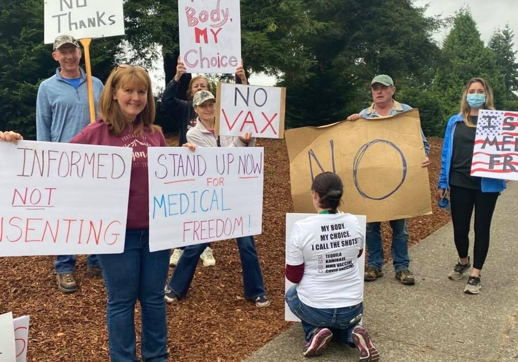 Healthcare workers and community members protest vaccine mandates.