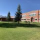 Historic School Building with Scenic Mountain Backdrop