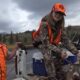 Hunting Success: Father and Daughter with Deer
